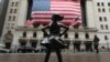 The Fearless Girl statue stands in front of the New York Stock Exchange near Wall Street in New York City, March 23, 2020. 