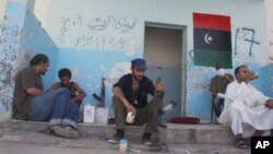 Pro-NTC fighters waiting for action near the Gadhafi-held town of Bani Walid, September 4, 2011.