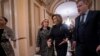 Speaker of the House Nancy Pelosi, D-Calif., holds hands with Rep. Debbie Dingell, D-Mich., at the Capitol in Washington, Dec. 18, 2019. 