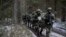 FILE - Lithuanian conscripts practice during a NATO military exercise at the Rukla military base west of the capital Vilnius, Lithuania, Nov. 28, 2016.