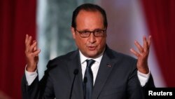 French President Francois Hollande attends his news conference at the Elysee Palace in Paris, Sept. 7, 2015. 