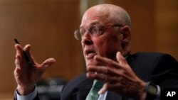 FILE - Former Treasury Secretary Henry Paulson testifies on Capitol Hill in Washington, D.C., May 6, 2010.