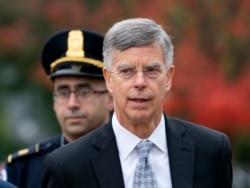 Ambassador William Taylor is escorted by U.S. Capitol Police as he arrives to testify before House committees as part of the Democrats' impeachment investigation of President Donald Trump, at the Capitol in Washington, Oct. 22, 2019.