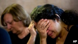 FILE - Loved ones grieve during prayers for the departed, remembering the victims of EgyptAir flight 804 in Cairo, Egypt, May 22, 2016. 