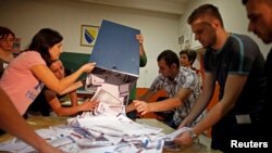 FILE - 2014 Election Commission officials count votes in the central Bosnian town of Zenica.