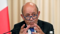 FILE - French Foreign Minister Jean-Yves Le Drian speaks after a meeting of the Russian-French Security Cooperation Council in Moscow, Sept. 9, 2019.
