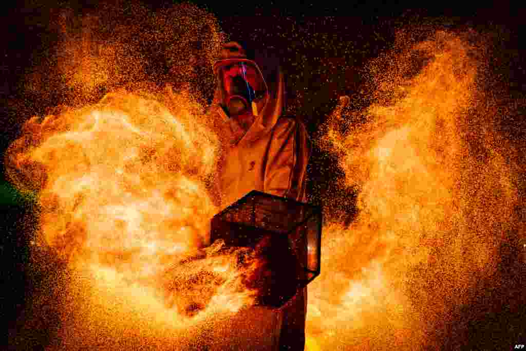 A man performs during an art exhibition called "Fire Show" during the Chinese Lantern Festival in Santiago, Chile, Feb. 15, 2025.