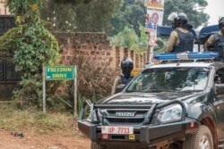 A patrol car of the Ugandan police is seen stationed outside the compound of opposition leader Bobi WIne on Jan. 20, 2021.