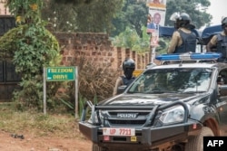 A patrol car of the Ugandan police is seen stationed outside the compound of opposition leader Bobi WIne on Jan. 20, 2021.