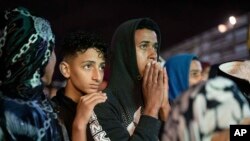 FILE: Moroccans watch the World Cup semifinal soccer match between France and Morocco played in Qatar, at a public viewing place in Rabat, Morocco, Wednesday, Dec. 14, 2022. 