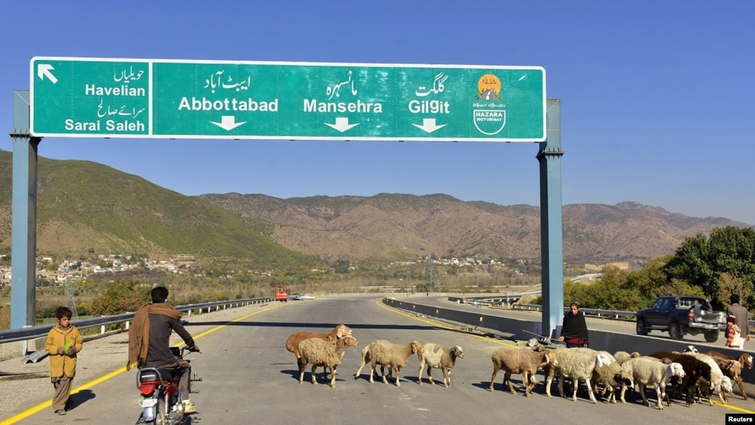 A Pakistani motorcyclist drives on a newly built Pakistan China Silk Road in Haripur, Pakistan, Dec. 22, 2017.