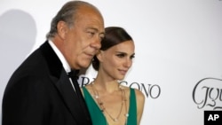 Fawaz Gruosi and Natalie Portman pose for photographers upon arrival for the De Grisogono party at the Hotel du Cap-Eden-Roc, on the sidelines of the 68th Cannes international film festival, Cap d'Antibes, southern France, May 19, 2015. 