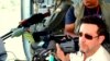 VOA Correspondent Steve Herman shooting video from a Sri Lanka air force helicopter, May 2009, over territory of the Tamil Tigers just prior to their civil war defeat.