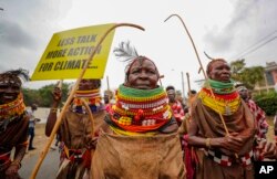 FILE - Protesters march to demand action on climate change, in the streets, in Nairobi, Kenya, Monday, Sept. 4, 2023 as the Africa Climate Summit begins.