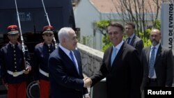 Le Président élu du Brésil, Jair Bolsonaro, et le Premier ministre israélien, Benjamin Netanyahu, avant un déjeuner à Rio de Janeiro, au Brésil, le 28 décembre 2018. Leo Correa / Pool via REUTERS - 