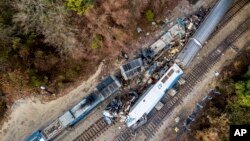 An aerial view of the site of an early morning train crash Feb. 4, 2018, between an Amtrak train, bottom right, and a CSX freight train, top left, in Cayce, SC. The Amtrak passenger train slammed into a freight train in the early morning darkness Feb. 4, 2018. 