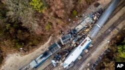 An aerial view of the site of an early morning train crash Feb. 4, 2018, between an Amtrak train, bottom right, and a CSX freight train, top left, in Cayce, South Carolina. The Amtrak passenger train slammed into a freight train in the early morning darkness Sunday, killing at least two Amtrak crew members and injuring more than 110 people, authorities said. 