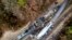An aerial view of the site of an early morning train crash Feb. 4, 2018, between an Amtrak train, bottom right, and a CSX freight train, top left, in Cayce, South Carolina. The Amtrak passenger train slammed into a freight train in the early morning darkness Sunday, killing at least two Amtrak crew members and injuring more than 110 people, authorities said. 