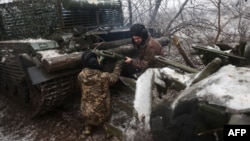 Ukrainian tank crews take part in a military drill not far from the front line in the Bakhmut direction, in the Donetsk region, on December 15, 2023, amid the Russian invasion of Ukraine.