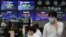 A currency trader talks on the mobile phone at the foreign exchange dealing room of the KEB Hana Bank headquarters in Seoul, South Korea, July 9, 2020.