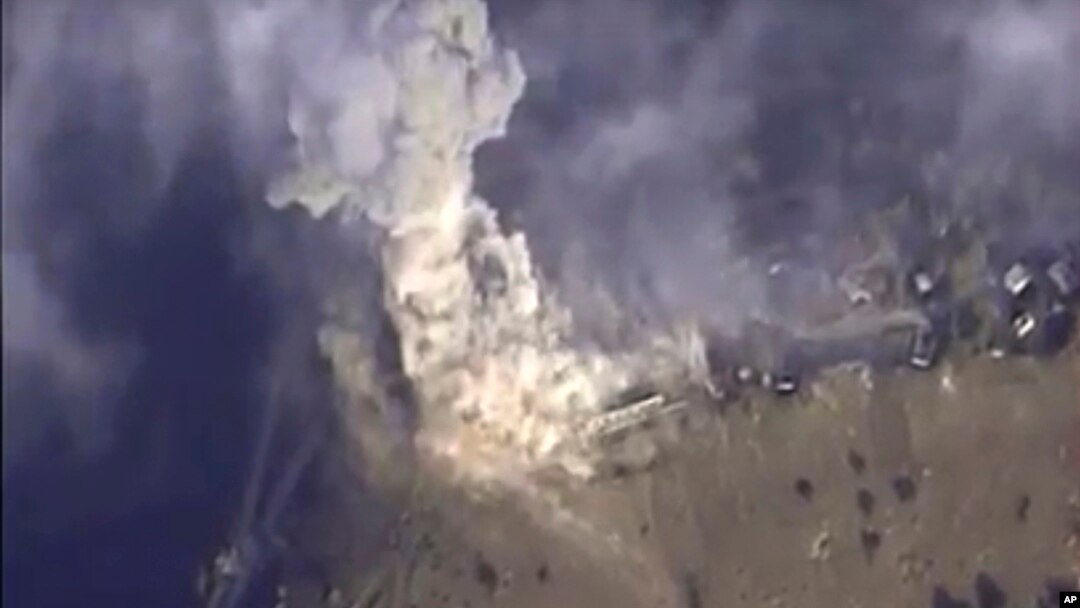 This photo made from footage taken from the Russian Defense Ministry official websiteNov. 2, 2015, shows a Russian airstrike hit a target in Syria. The Russian Defense Ministry said the strike was performed by an Su-34M bomber in Aleppo province. 