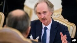 Geir Pedersen, the United Nations' new special envoy for Syria, gestures while speaking to Russian Foreign Minister Sergey Lavrov, back to a camera, during their talks in Moscow, Russia, Jan. 21, 2019.