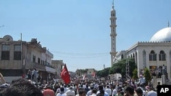 Demonstrators protest against Syria's President Bashar al-Assad gather in Hula, near Homs in this undated handout photo released November 4, 2011.