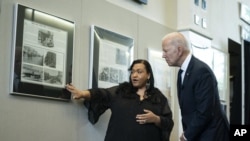 Michelle Brown-Burdex, program coordinator of the Greenwood Cultural Center, speaks as she leads President Joe Biden on a tour of the Greenwood Cultural Center to mark the 100th anniversary of the Tulsa race massacre, Tuesday, June 1, 2021, in Tulsa. (AP 