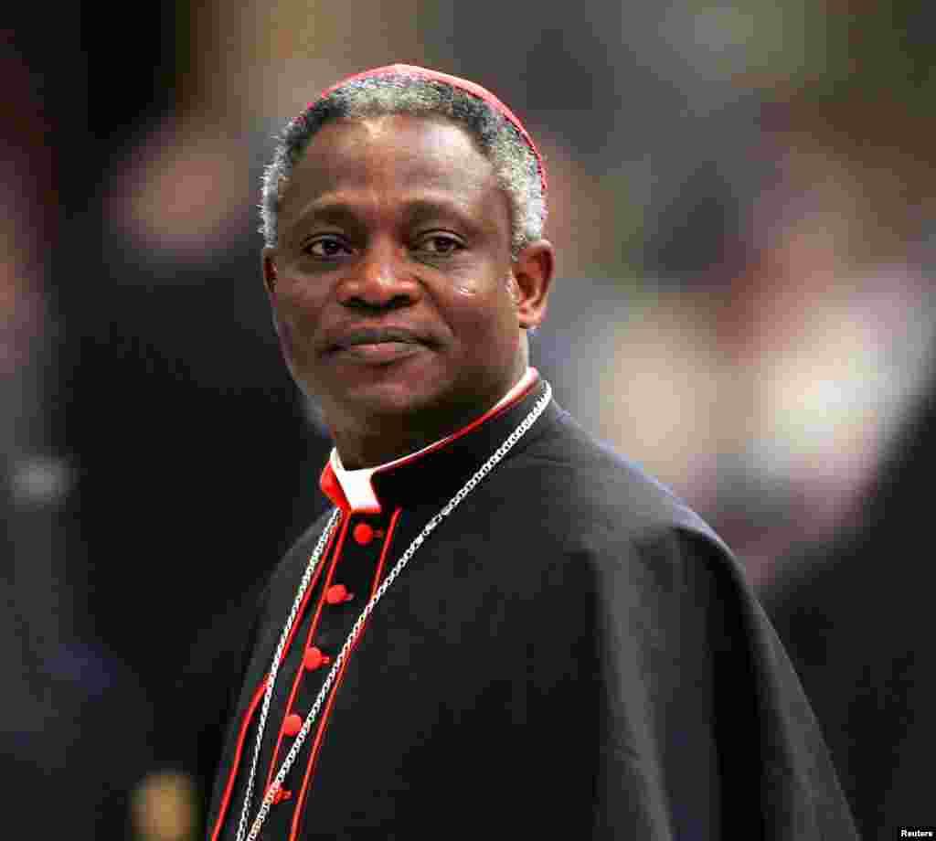 Cardinal Peter Kodwo Appiah Turkson of Ghana arrives to attend a mass led by bishop Leonardo Sandri of Argentina in St. Peter's Basilica at the Vatican, April 13, 2005.