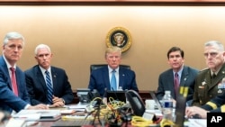 In this image released by the White House, President Donald Trump is joined by Vice President Mike Pence, second from left, national security adviser Robert O’Brien, left; Secretary of Defense Mark Esper, second from right, and Chairman of the…