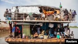 South Sudanese returnees arrive at the port in Juba, August 31, 2012. Tens of thousands remain stranded in Sudan and in camps near the border. (Reuters) 