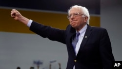 Democratic presidential candidate Sen. Bernie Sanders, I-Vt., arrives to speak to supporters at a primary night election rally in Manchester, N.H., Tuesday, Feb. 11, 2020.