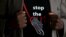 FILE - A T-shirt warns against female genital mutilation. Its wearer attends an event, discouraging harmful practices such as FGM, at a girls high school in Imbirikani, Kenya, April 21, 2016.
