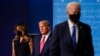 First lady Melania Trump and President Donald Trump, center, remain on stage as Democratic presidential candidate former Vice President Joe Biden walks away at the end of the final presidential debate Thursday, Oct. 22, 2020, in Nashville, Tenn.