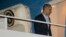 President Barack Obama boards Air Force One before his departure from Andrews Air Force Base, Sunday, March 23, 2014. 