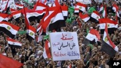 Protesters shout anti-military ruling council slogans in Tahrir Square, the focal point of Egypt's revolution that ousted President Hosni Mubarak, in Cairo, Egypt, Friday, Nov. 18, 2011