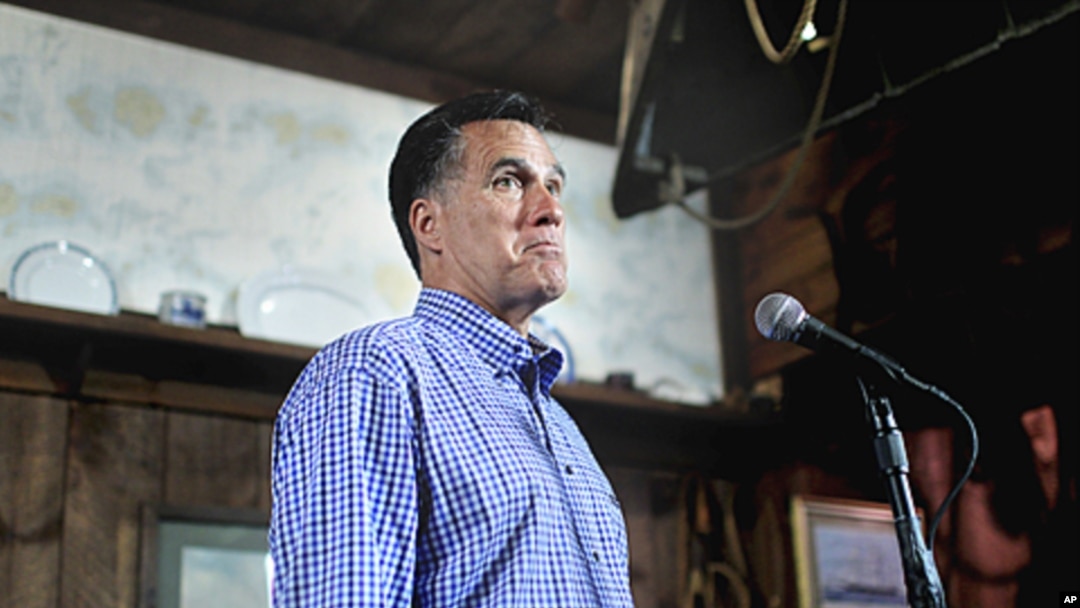 Republican presidential candidate, former Massachusetts Governor Mitt Romney holds news conference after talking with local business owners at a town hall meeting in Hampton, New Hampshire, July 5, 2011