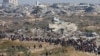 Palestinians, who were displaced to the south at Israel's order during the war, make their way back to their homes in northern Gaza, amid a ceasefire between Israel and Hamas, near Gaza City, Jan. 27, 2025. 