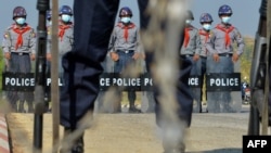 FILE - Police block a road in Naypyidaw, Myanmar, Jan. 29, 2021, ahead of the reopening of the parliament on Feb. 1 following the November 2020 elections which Aung San Suu Kyi's ruling National League for Democracy (NLD) won by a landslide.