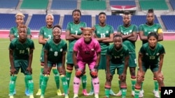 FILE - Players of Zambia line up for a photo before a women's soccer match against Brazil at the 2020 Summer Olympics, Tuesday, July 27, 2021, in Saitama, Japan.