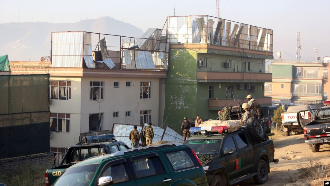 Afghan security forces inspect the site of an attack in Kabul, Afghanistan, Nov. 28, 2014. 