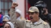 President Nicolas Maduro gestures to supporters during an event marking the 165th anniversary of the Battle of Santa Ines, in Caracas, Venezuela, Dec. 10, 2024. 