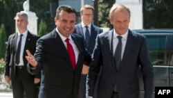 Macedonian Prime Minister Zoran Zaev (L) welcomes European Council President Donald Tusk upon his arrival in Skopje, Sept. 17, 2019. 