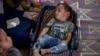 FILE - Displaced infant Abdel-Rahman Abu El-Jedian, who suffers from polio, sleeps at a makeshift tent camp in Deir al-Balah, Gaza Strip, on Aug. 27, 2024. A third polio vaccine campaign in Gaza began Feb. 22, 2025.