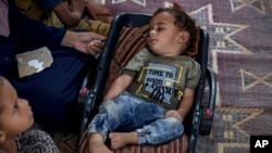 FILE - Displaced infant Abdel-Rahman Abu El-Jedian, who suffers from polio, sleeps at a makeshift tent camp in Deir al-Balah, Gaza Strip, on Aug. 27, 2024. A third polio vaccine campaign in Gaza began Feb. 22, 2025.