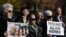 FILE - Demonstrators gather during a rally for U.S. detainee Alan Gross in Lafayette Square in Washington, Dec. 3, 2013. 