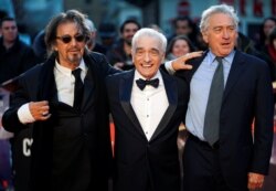 FILE - Director Martin Scorsese and cast members Al Pacino and Robert De Niro pose as they arrive for the screening of "The Irishman" during the 2019 BFI London Film Festival at the Odeon Luxe Leicester Square in London, Oct. 13, 2019.