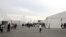 Pengungsi Afghanistan berjalan di luar fasilitas perumahan sementara di Liberty Village, Pangkalan Bersama McGuire-Dix- Lakehurst di New Jersey, AS, 2 Desember 2021. (REUTERS/Barbara Davidson)