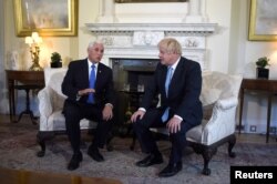 U.S. Vice-President Mike Pence meets with Britain's Prime Minister Boris Johnson on Downing Street in London, Sept. 5, 2019.