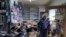 Kenny Ransbottom walks through debris inside his auto parts store after an earthquake in Rio Dell, California, Dec. 20, 2022. 